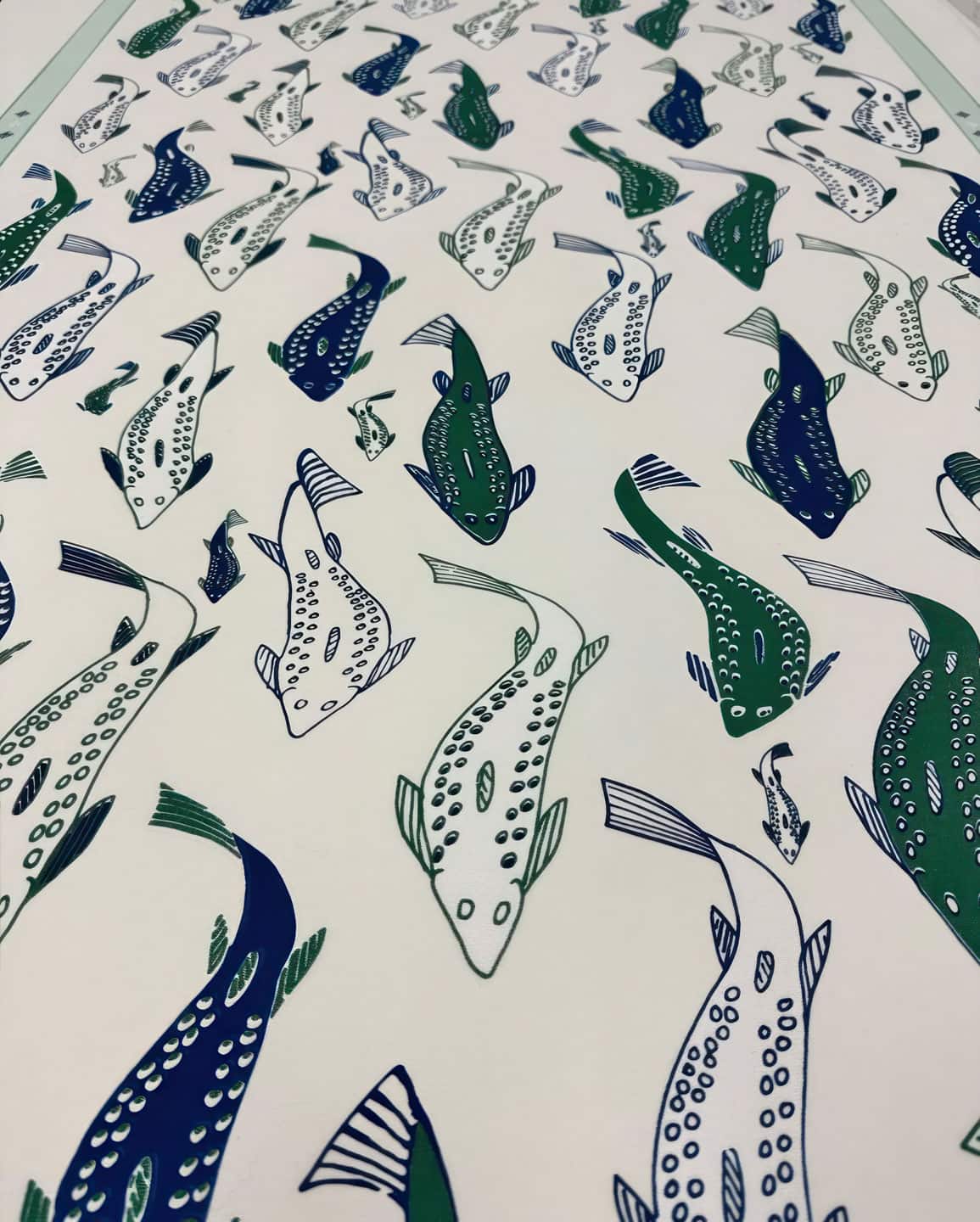 Quvianaqtuk Pudlate, Fish, 2023, sample crop of 122×39½ in silk-screened tapestry. Pattern designed by Alex Fischer from comissioned drawings by Quvianaqtuk Pudlate.